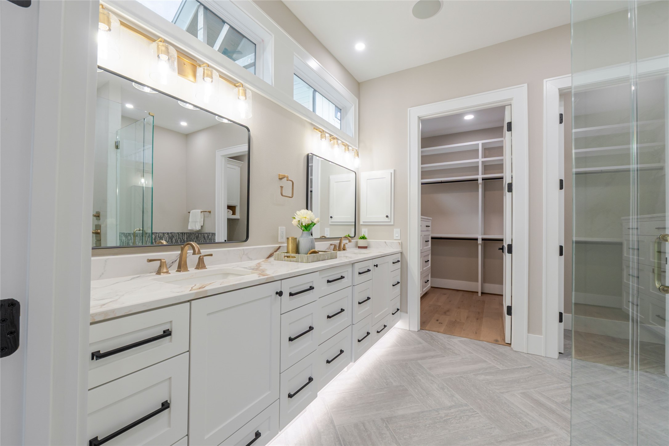 3100 Garwood Street Austin, TX 78702 - Photo 15 of 25 Full bath with double vanity, parquet flooring, a spacious closet, recessed lighting, and a stall shower