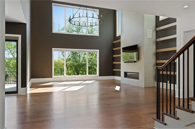 a kitchen with a sink refrigerator and cabinets