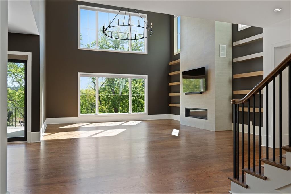 1285 Stuart Ridge Johns Creek, GA 30022 - Photo 12 of 89 a view of an empty room with wooden floor and a window
