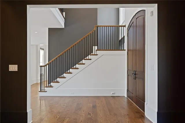 a view of a porch with wooden floor and windows