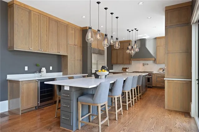 a bathroom with a tub a sink and potted plant