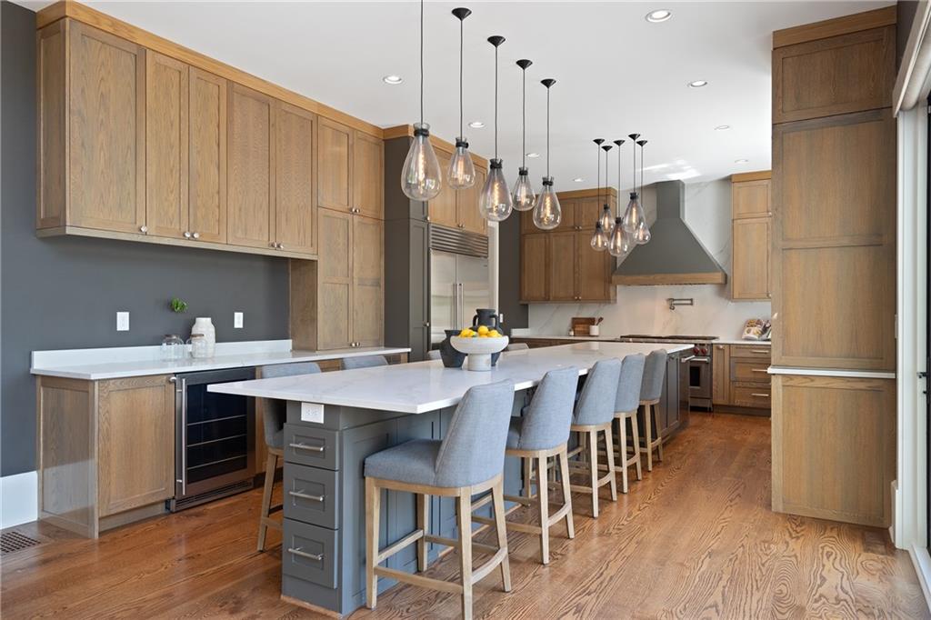 1285 Stuart Ridge Johns Creek, GA 30022 - Photo 22 of 89 a kitchen with a sink refrigerator and cabinets