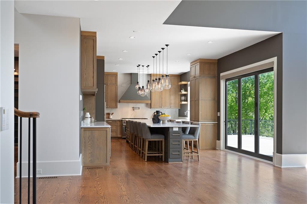 1285 Stuart Ridge Johns Creek, GA 30022 - Photo 32 of 89 a view of a dining room with furniture window and wooden floor