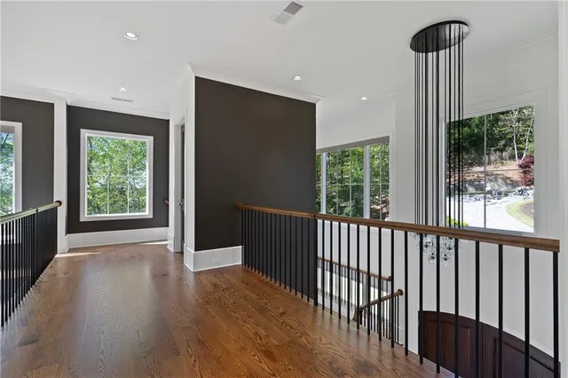 a bedroom with a bed closet and a large window