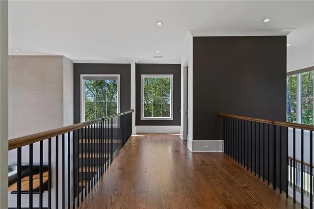 a bathroom with a granite countertop sink a toilet and a mirror