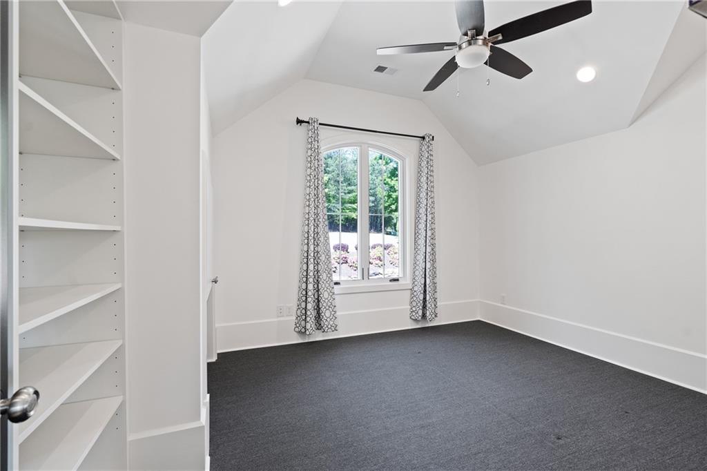 1285 Stuart Ridge Johns Creek, GA 30022 - Photo 41 of 89 a view of room with window and ceiling fan