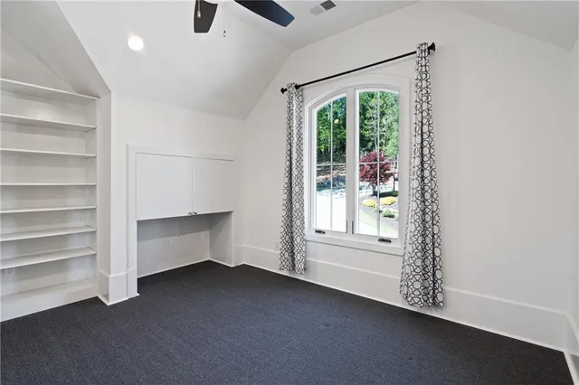 a view of swimming pool with seating area