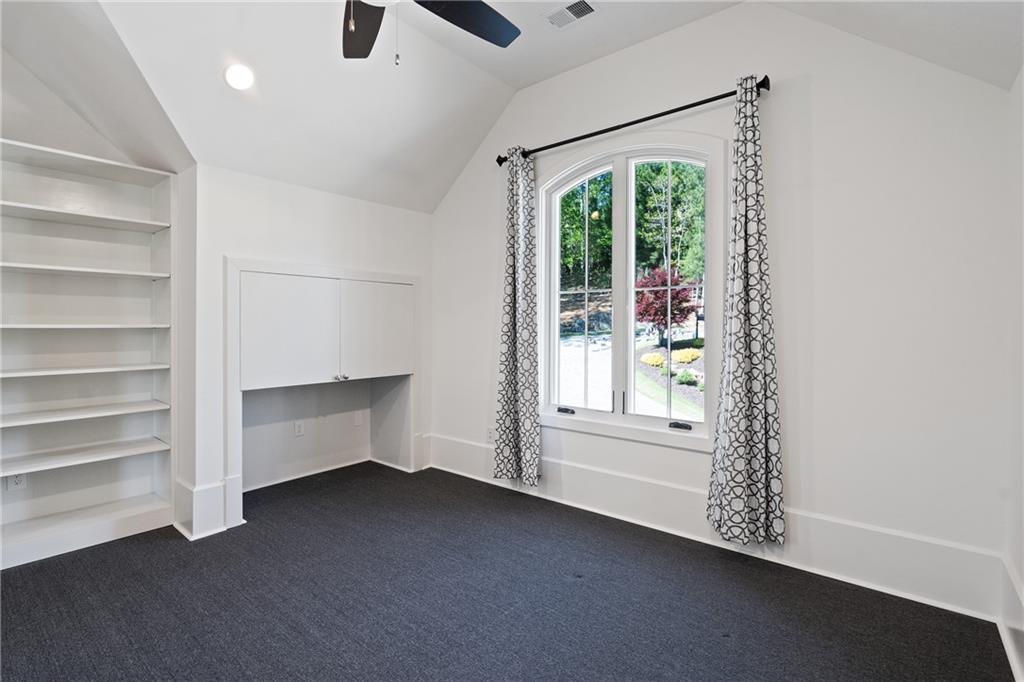 1285 Stuart Ridge Johns Creek, GA 30022 - Photo 42 of 89 a view of room with window and ceiling fan