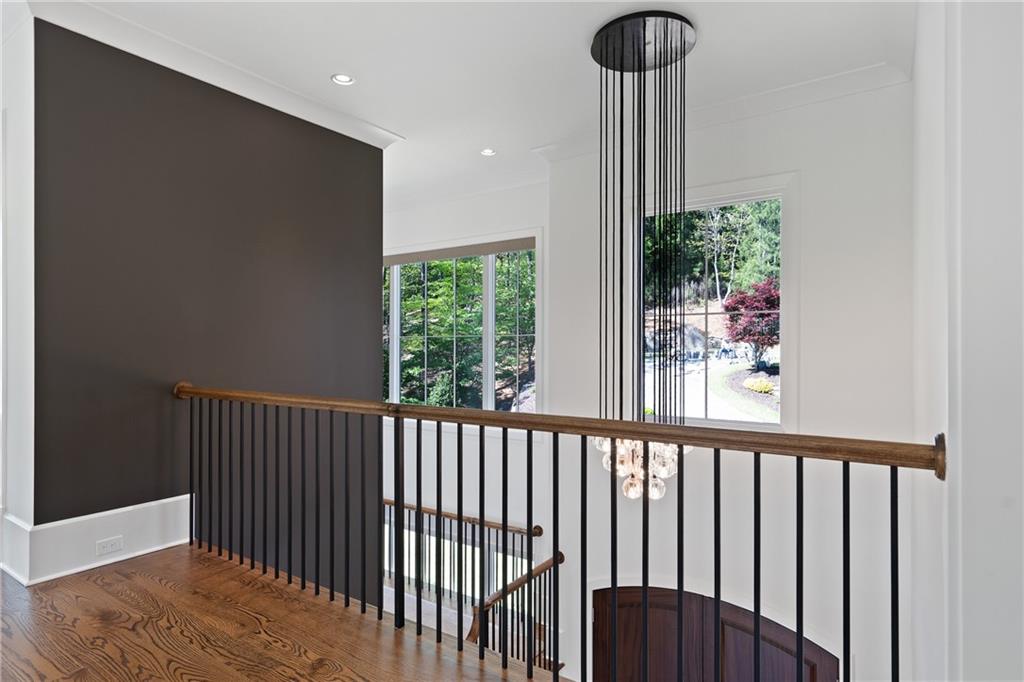 1285 Stuart Ridge Johns Creek, GA 30022 - Photo 43 of 89 a view of a porch with a floor to ceiling window and wooden floor
