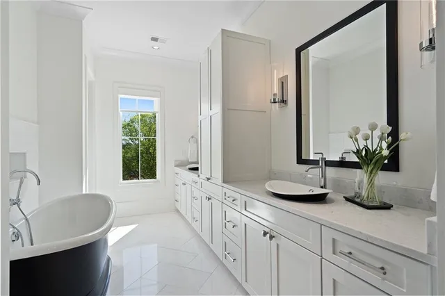 an aerial view of a house with swimming pool and garden view