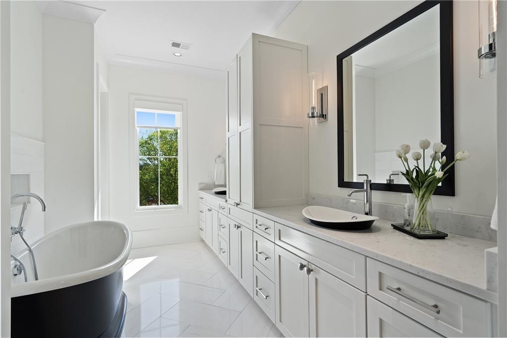 1285 Stuart Ridge Johns Creek, GA 30022 - Photo 46 of 89 a bathroom with a tub a sink and potted plant