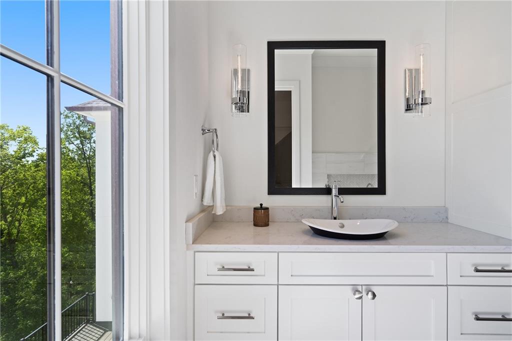1285 Stuart Ridge Johns Creek, GA 30022 - Photo 48 of 89 a bathroom with a double vanity sink and a mirror