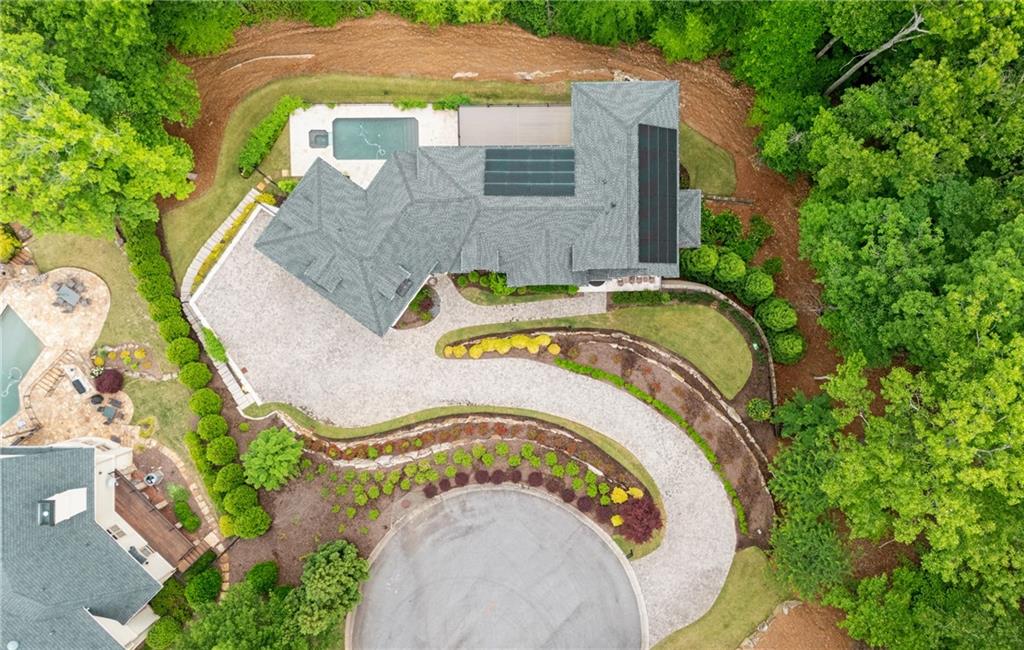 1285 Stuart Ridge Johns Creek, GA 30022 - Photo 5 of 89 an aerial view of a house with a swimming pool