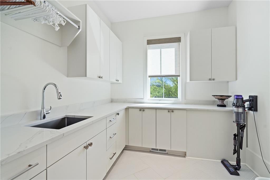 1285 Stuart Ridge Johns Creek, GA 30022 - Photo 56 of 89 a kitchen with a sink cabinets and window