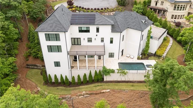 an aerial view of a house with a yard