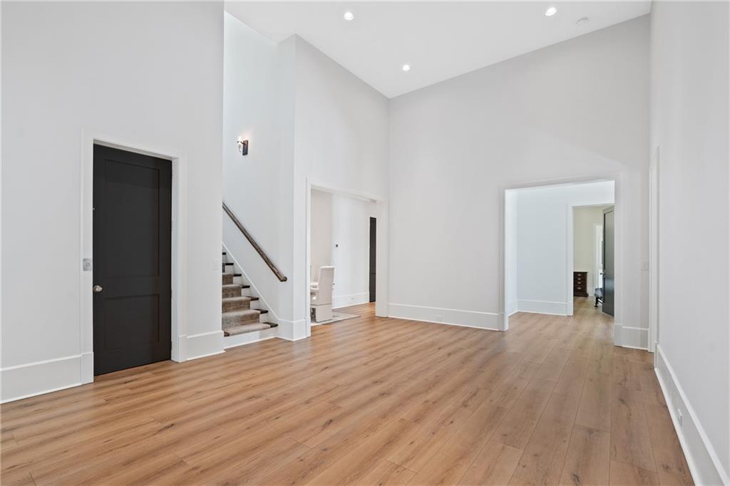 1285 Stuart Ridge Johns Creek, GA 30022 - Photo 63 of 89 a view of an empty room with wooden floor and stairs
