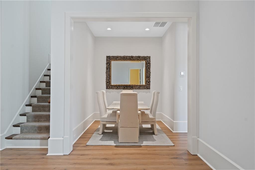 1285 Stuart Ridge Johns Creek, GA 30022 - Photo 64 of 89 a view of a hallway with wooden floor and staircase