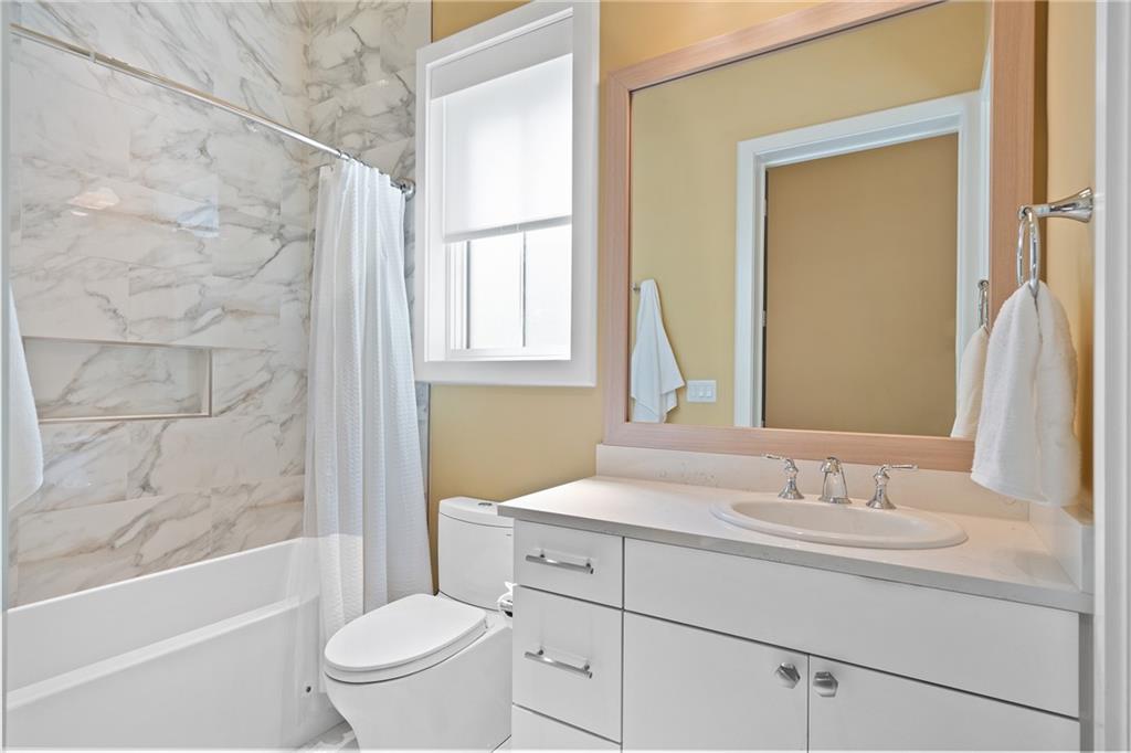 1285 Stuart Ridge Johns Creek, GA 30022 - Photo 67 of 89 a bathroom with a sink toilet vanity tub and shower