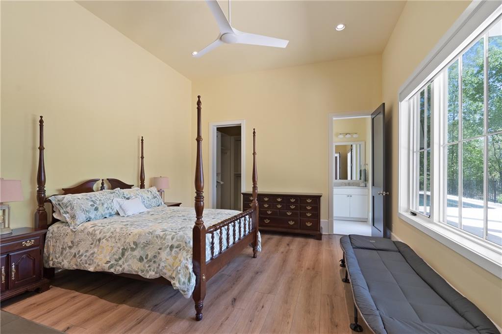 1285 Stuart Ridge Johns Creek, GA 30022 - Photo 69 of 89 a bedroom with furniture and a large window