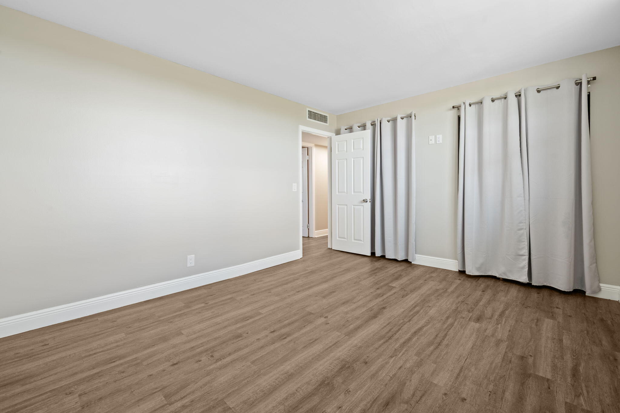 5700 Northwest 2nd Avenue, Unit 410 Boca Raton, FL 33487 - Photo 25 of 34 a view of wooden floor and closet in a room