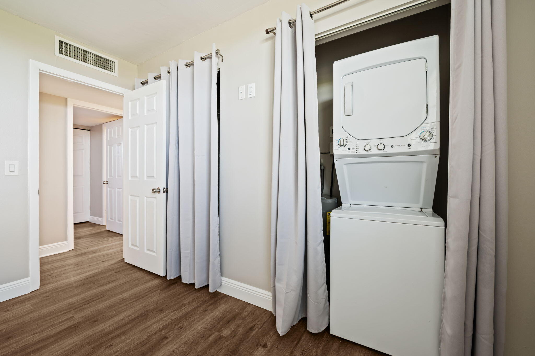 5700 Northwest 2nd Avenue, Unit 410 Boca Raton, FL 33487 - Photo 26 of 34 a view of a storage and utility room with wooden floor