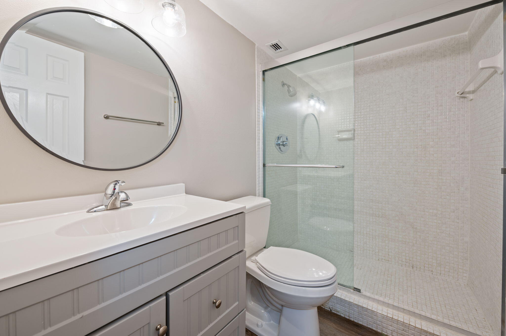 5700 Northwest 2nd Avenue, Unit 410 Boca Raton, FL 33487 - Photo 27 of 34 a bathroom with a sink a toilet and a mirror