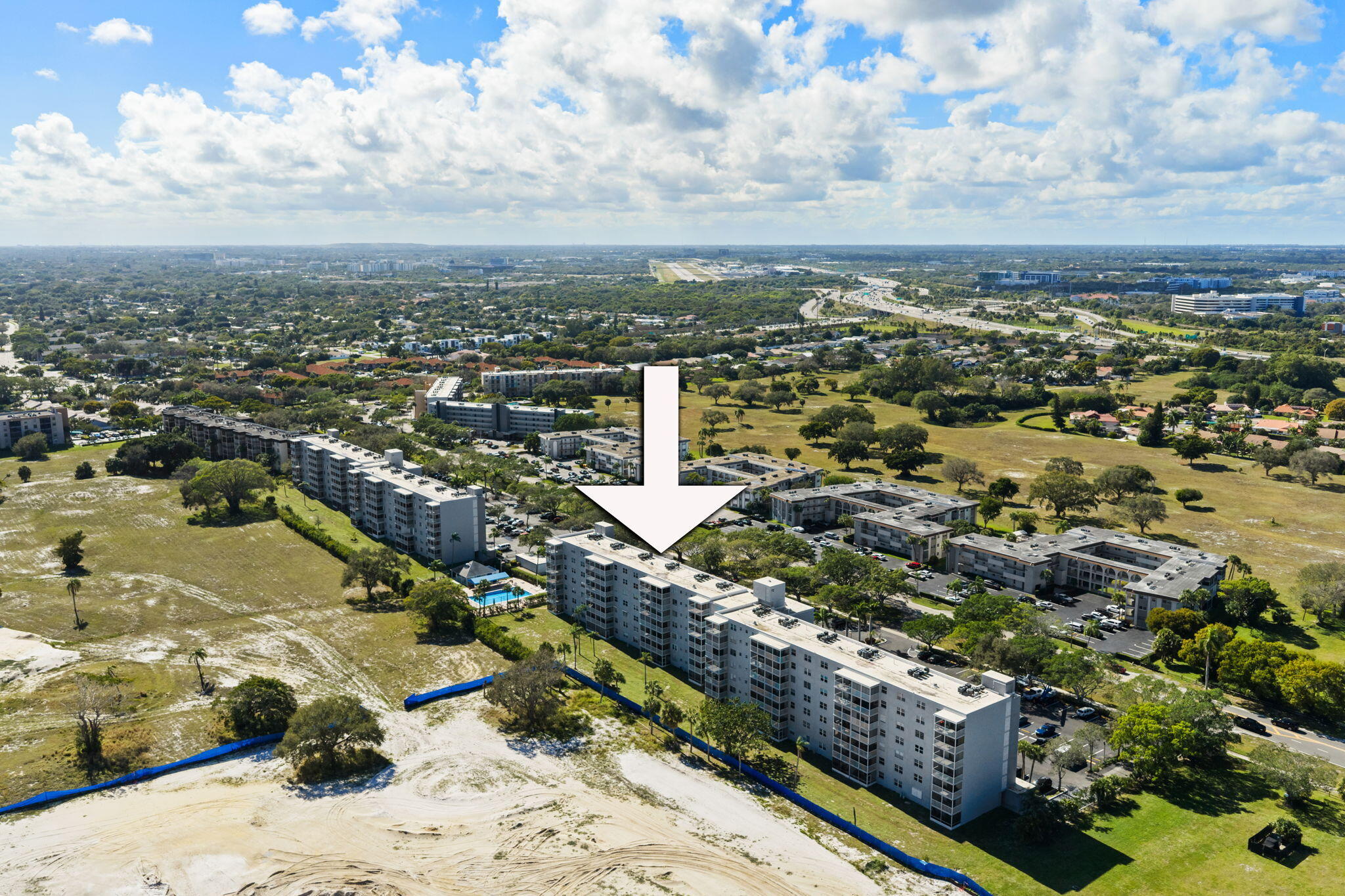 5700 Northwest 2nd Avenue, Unit 410 Boca Raton, FL 33487 - Photo 32 of 34 an aerial view of residential houses with outdoor space