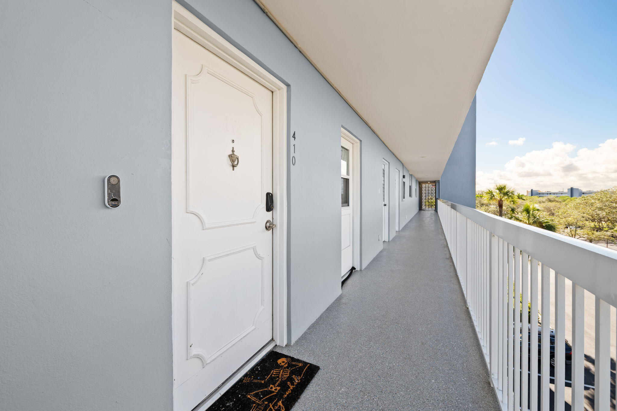 5700 Northwest 2nd Avenue, Unit 410 Boca Raton, FL 33487 - Photo 7 of 34 a view of a hallway with wooden floor and stairs