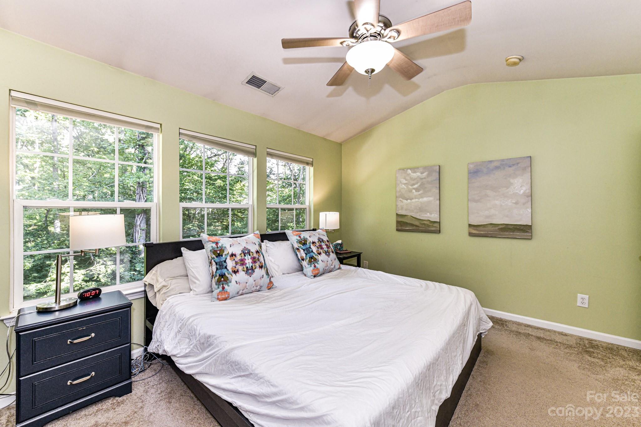 6991 Rothchild Drive Charlotte, NC 28270 - Photo 16 of 37 a bedroom with a large bed and a large window