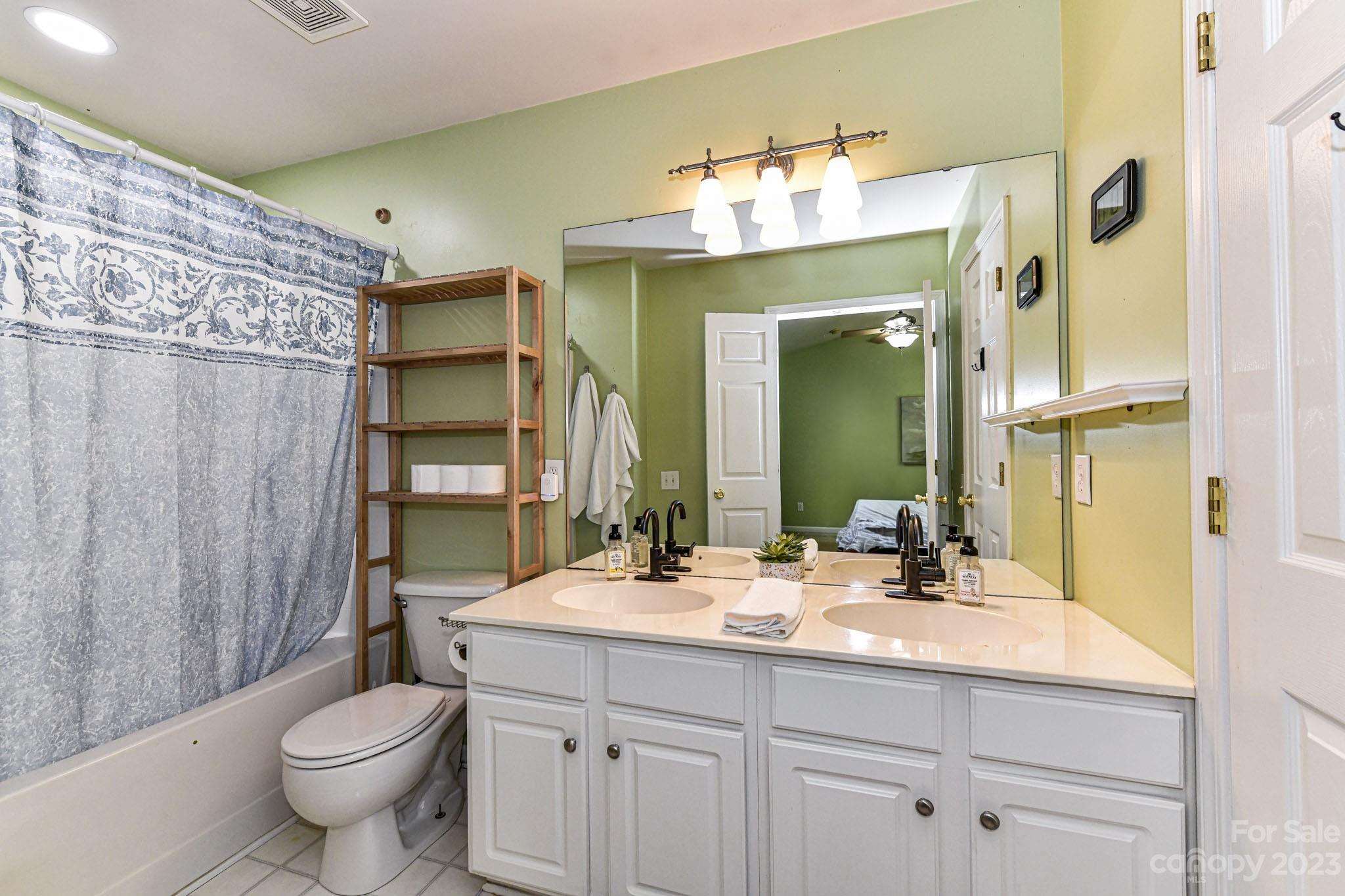 6991 Rothchild Drive Charlotte, NC 28270 - Photo 17 of 37 a bathroom with a double vanity sink mirror and toilet