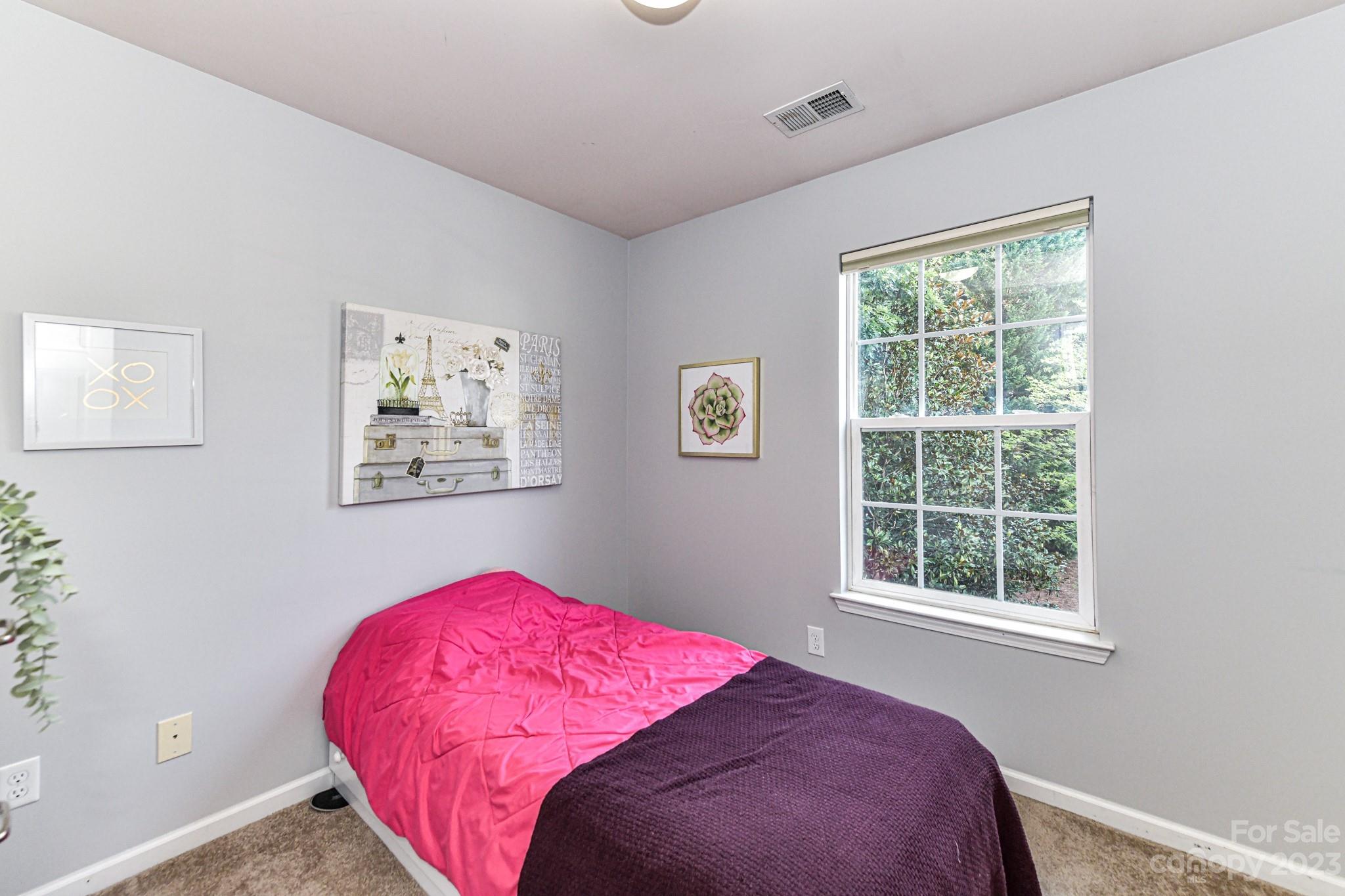 6991 Rothchild Drive Charlotte, NC 28270 - Photo 20 of 37 a bedroom with a bed and a window