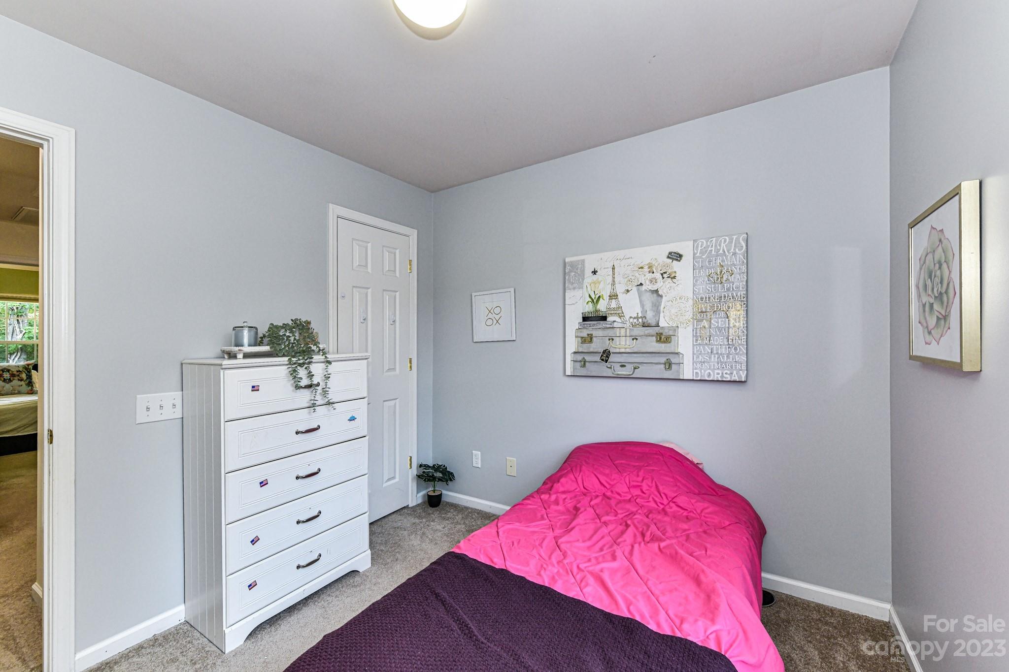 6991 Rothchild Drive Charlotte, NC 28270 - Photo 21 of 37 a bedroom with a bed and a dresser in it
