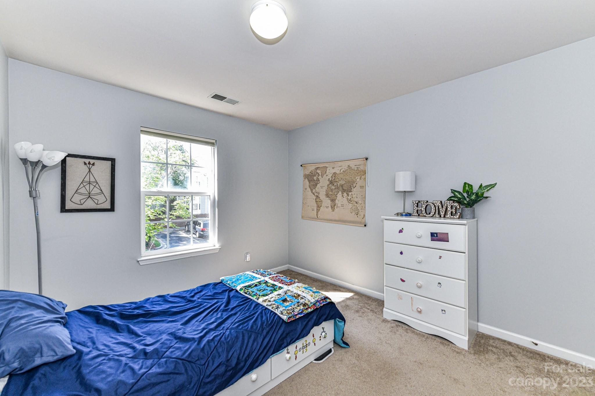6991 Rothchild Drive Charlotte, NC 28270 - Photo 22 of 37 a bedroom with a bed and a window