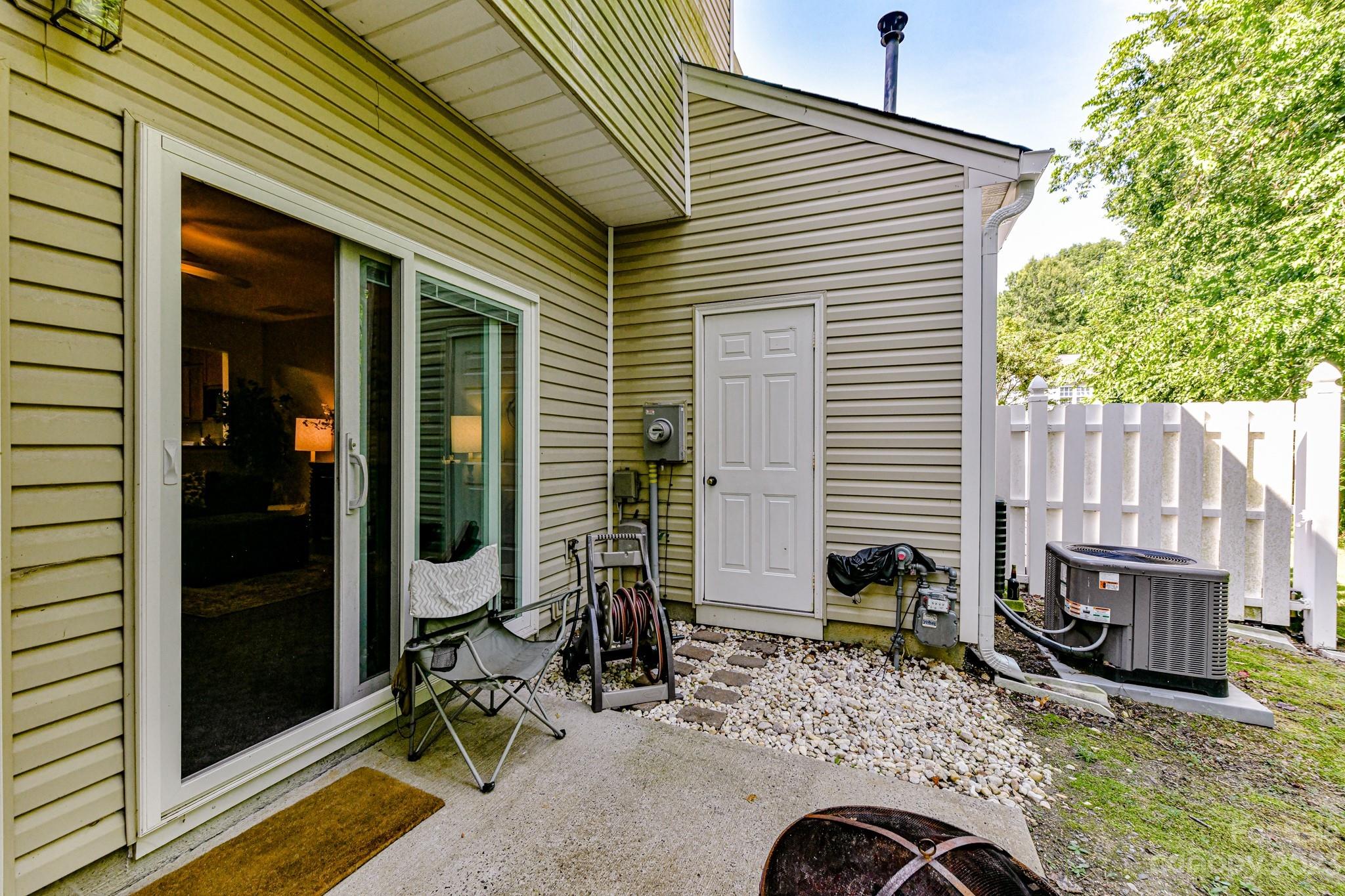 6991 Rothchild Drive Charlotte, NC 28270 - Photo 25 of 37 a backyard of a house with barbeque oven table and chairs