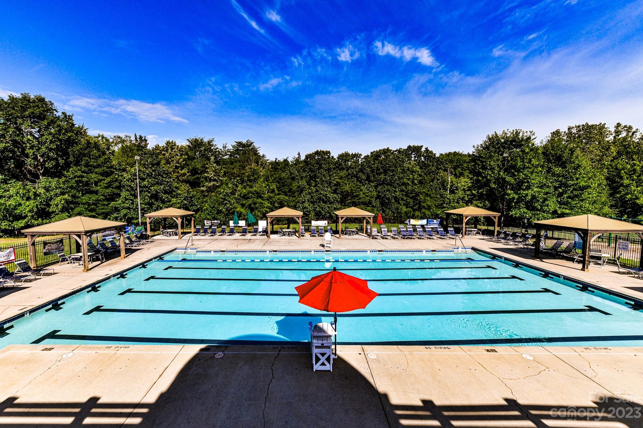 6991 Rothchild Drive Charlotte, NC 28270 - Photo 29 of 37 a view of a tennis ground with large trees