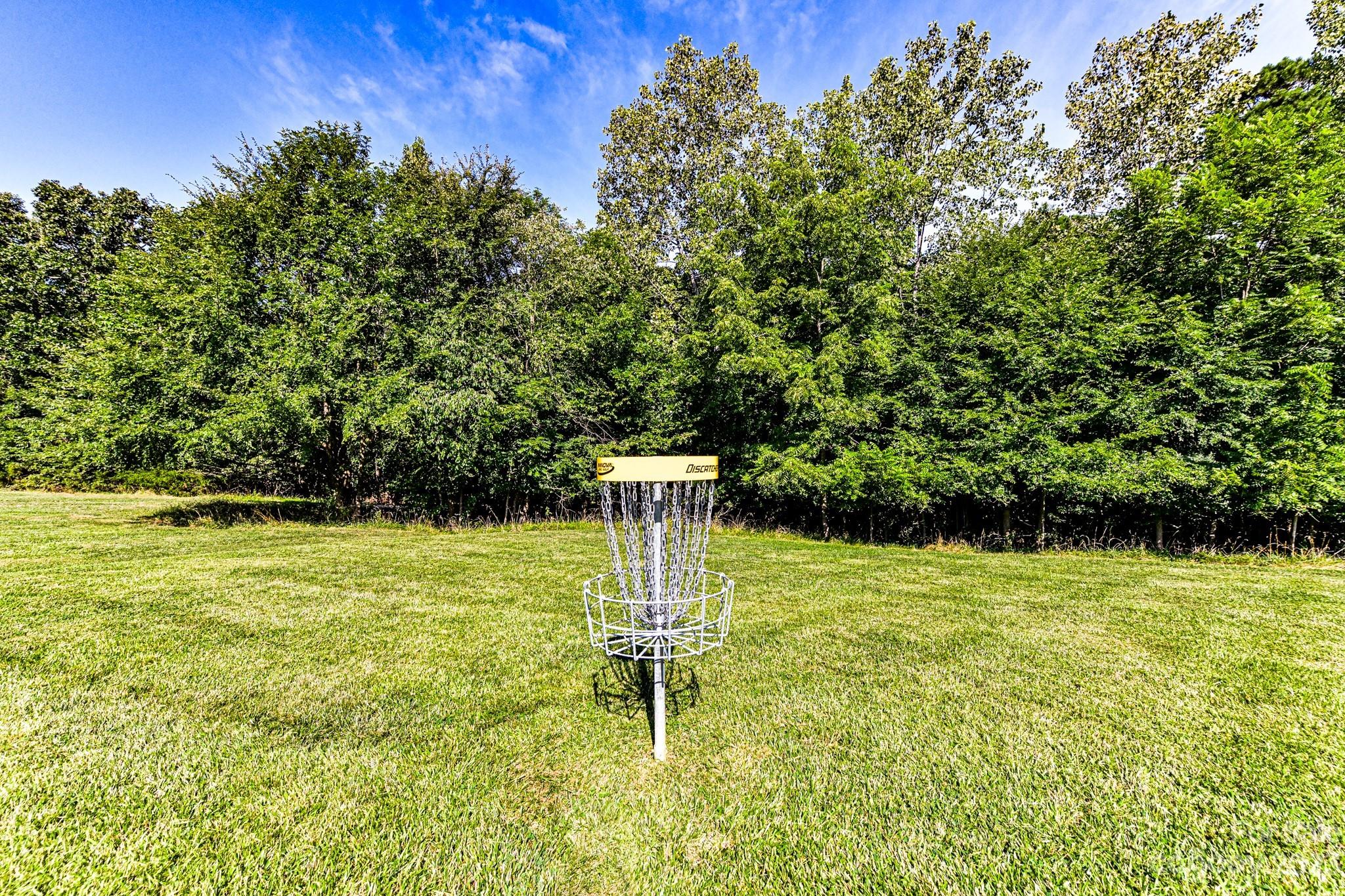 6991 Rothchild Drive Charlotte, NC 28270 - Photo 36 of 37 a garden with trees in front of it