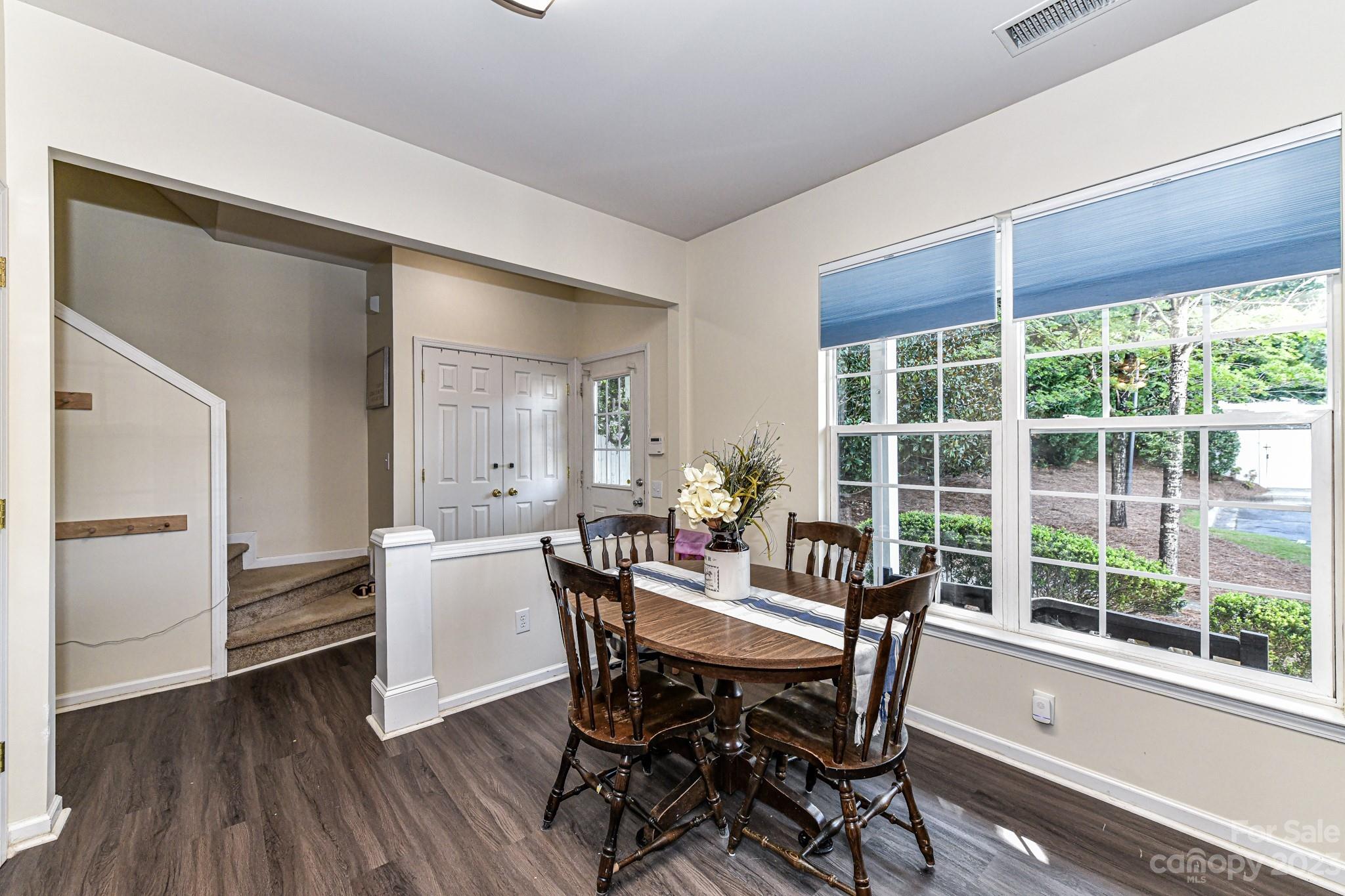 6991 Rothchild Drive Charlotte, NC 28270 - Photo 6 of 37 a view of a dining room with furniture window and wooden floor