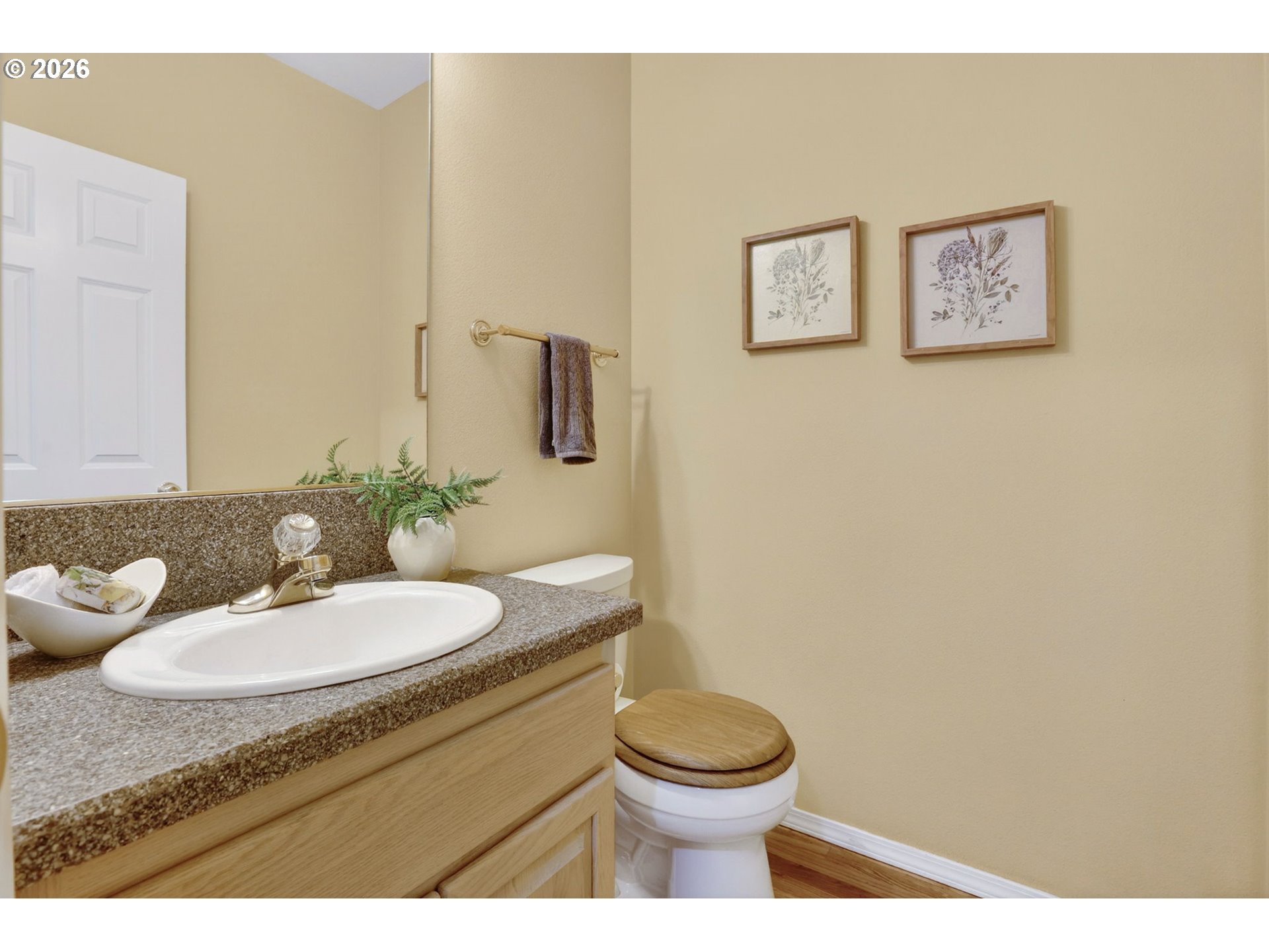 4714 Southwest 2nd Court Portland, OR 97239 - Photo 19 of 44 a bathroom with a toilet a sink and mirror