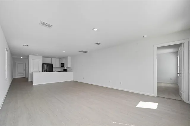 a view of kitchen and kitchen with a sink