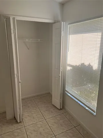 a view of a glass door with a yard