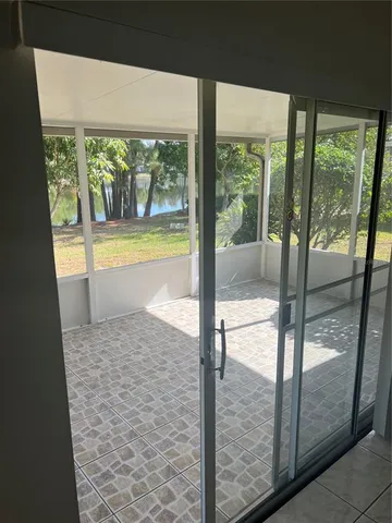 a view of a swimming pool with a porch