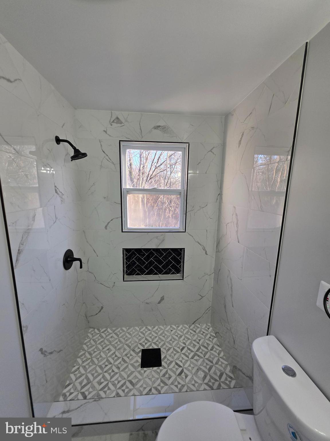 25294 Vista Road Hollywood, MD 20636 - Photo 23 of 53 a bathroom with a toilet sink and shower