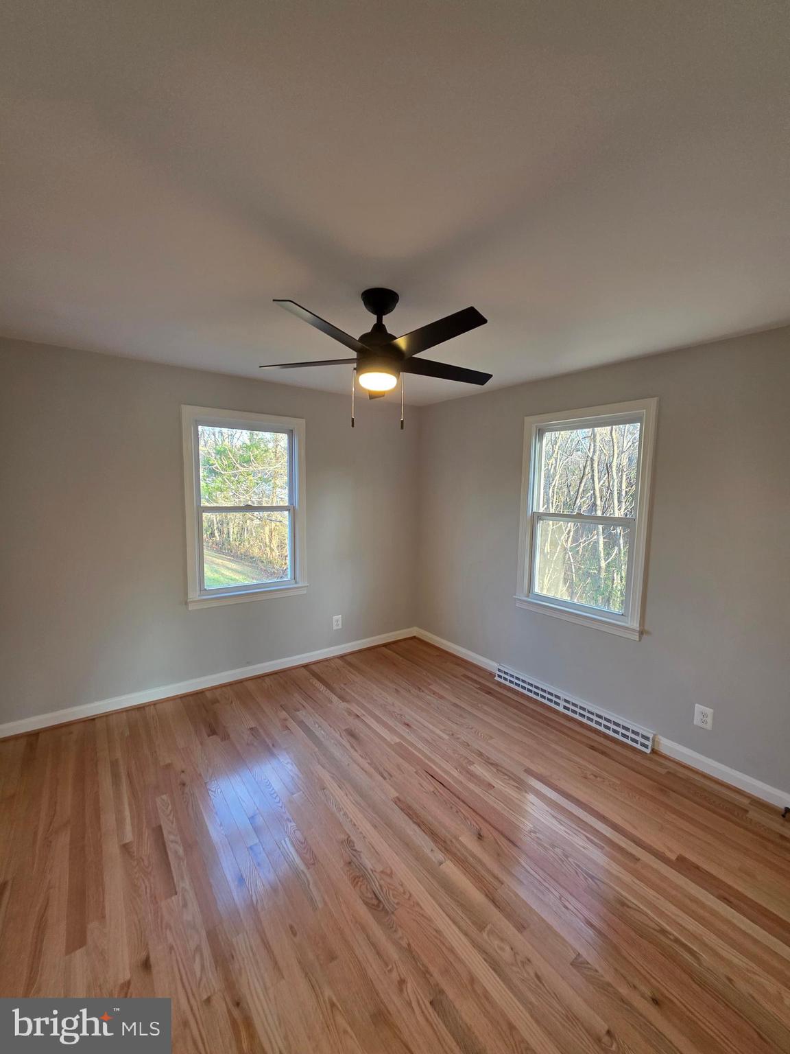 25294 Vista Road Hollywood, MD 20636 - Photo 27 of 53 wooden floor in an empty room with a window