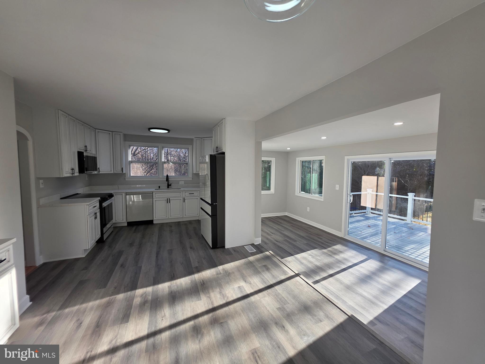 25294 Vista Road Hollywood, MD 20636 - Photo 39 of 53 a kitchen with stainless steel appliances granite countertop a refrigerator and stove