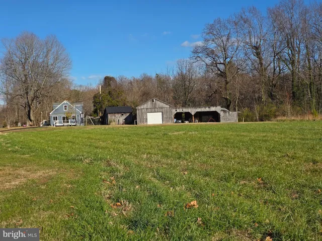 a bathroom with a toilet a sink and a shower