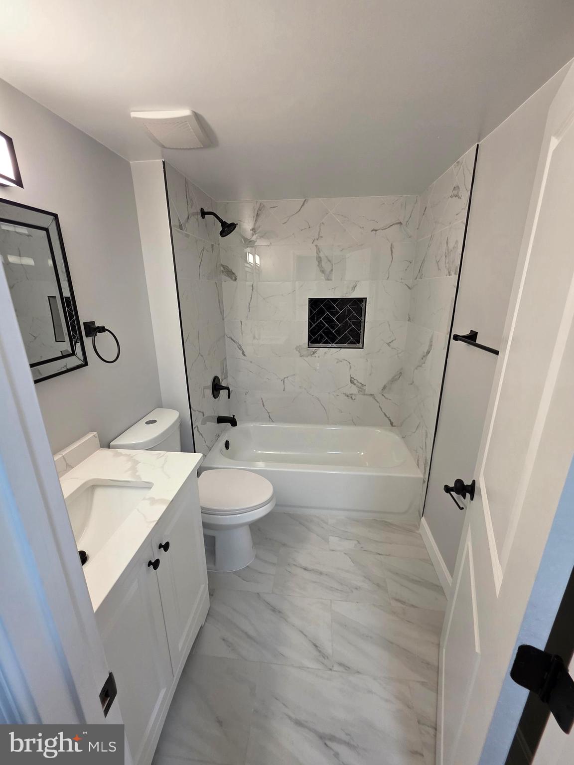 25294 Vista Road Hollywood, MD 20636 - Photo 44 of 53 a bathroom with a sink a toilet and a mirror