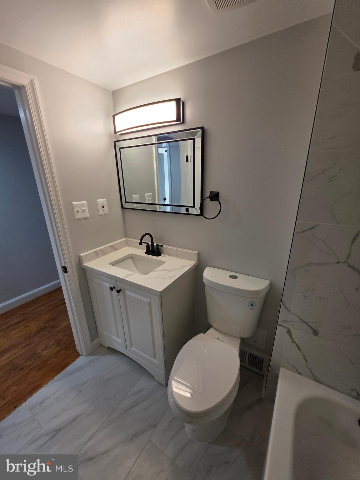 25294 Vista Road Hollywood, MD 20636 - Photo 47 of 53 a white toilet sitting next to a bathroom sink