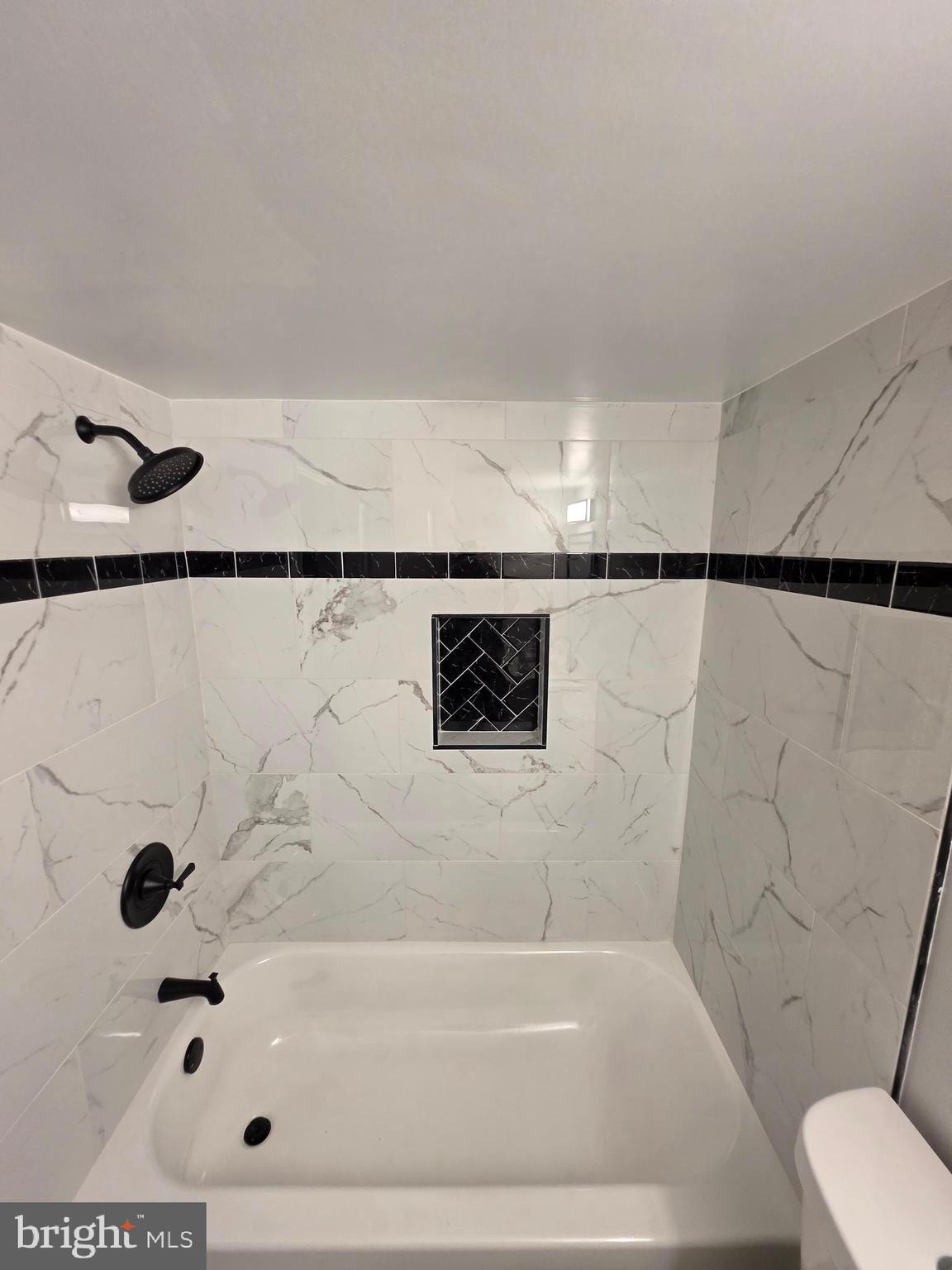 25294 Vista Road Hollywood, MD 20636 - Photo 53 of 53 a bathroom with a bathtub and a shower