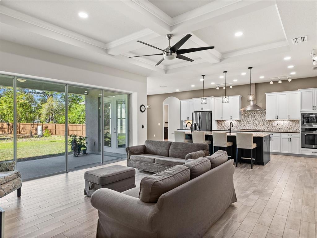 11981 Robina Road Weeki Wachee, FL 34614 - Photo 6 of 93 a living room with furniture and a large window with outer view
