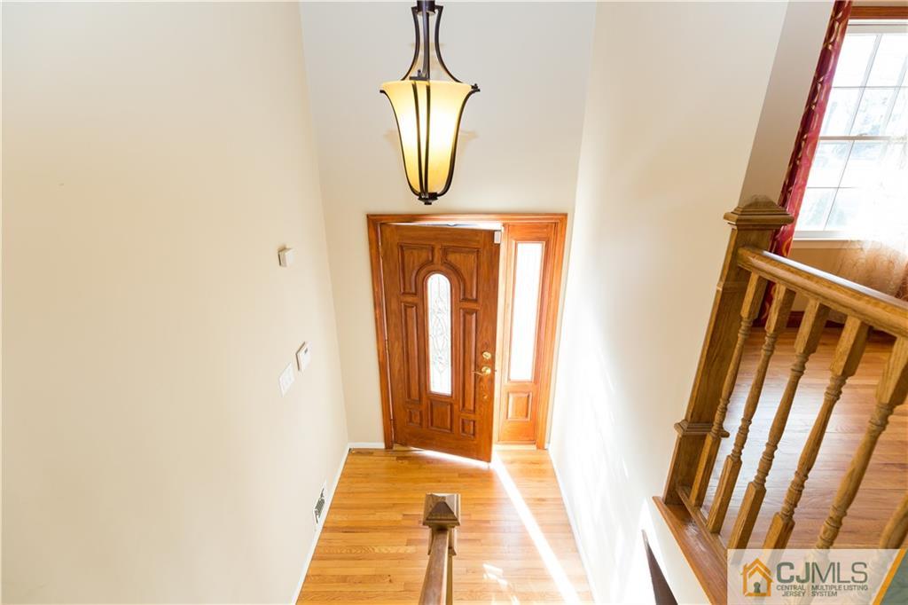 19 Bodnarik Road Edison, NJ 08837 - Photo 3 of 50 a front door view of a house with wooden floor and door